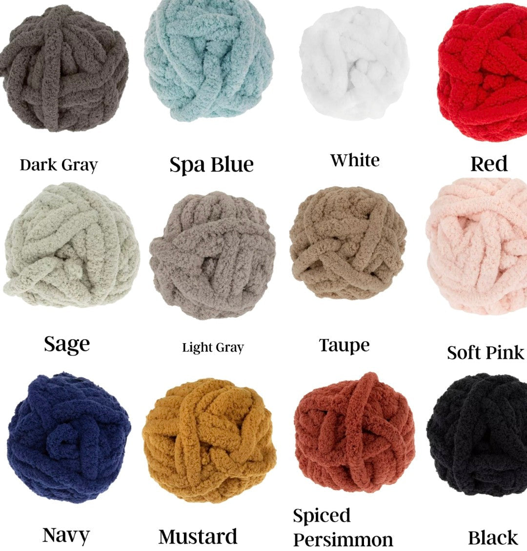 Collection of knitted yarn balls in various colors with labels.