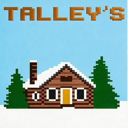 Log Cabin Chunky kbit blanket pattern with a wooden cabin with snow on the roof, surrounded by trees against a light blue background. The word Talleys in gold at the top