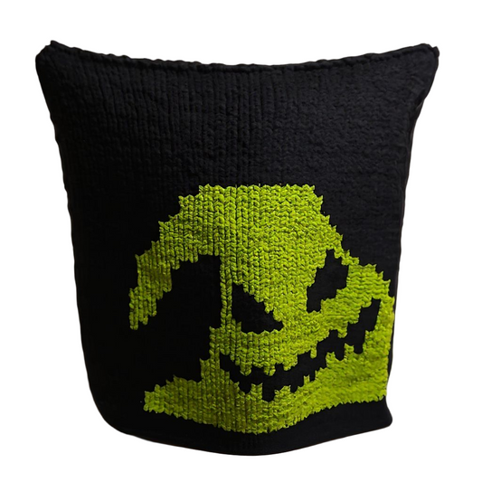 Black Blancket with a green pixelated skull design on a white background