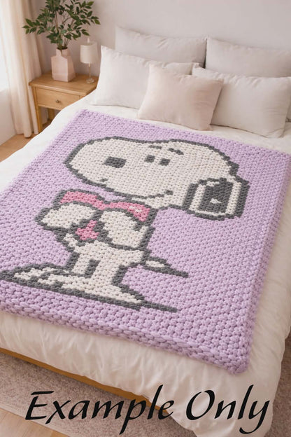 Blanket with a cartoon character on a bed in a bedroom setting